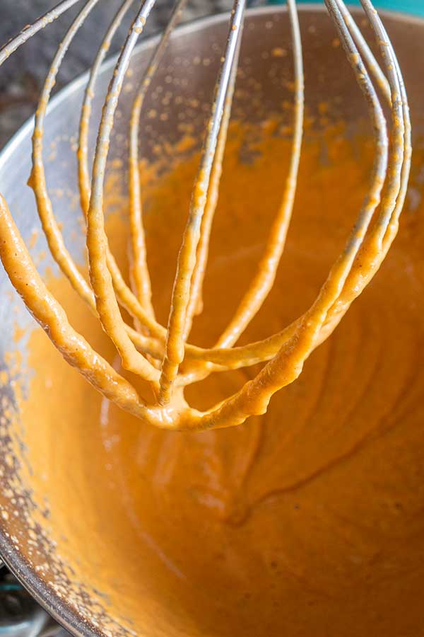 whisking pumpkin filling