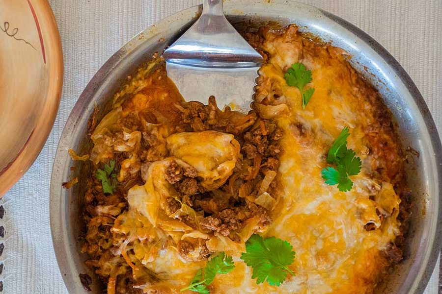 overview of cheesy cabbage chorizo in a skillet