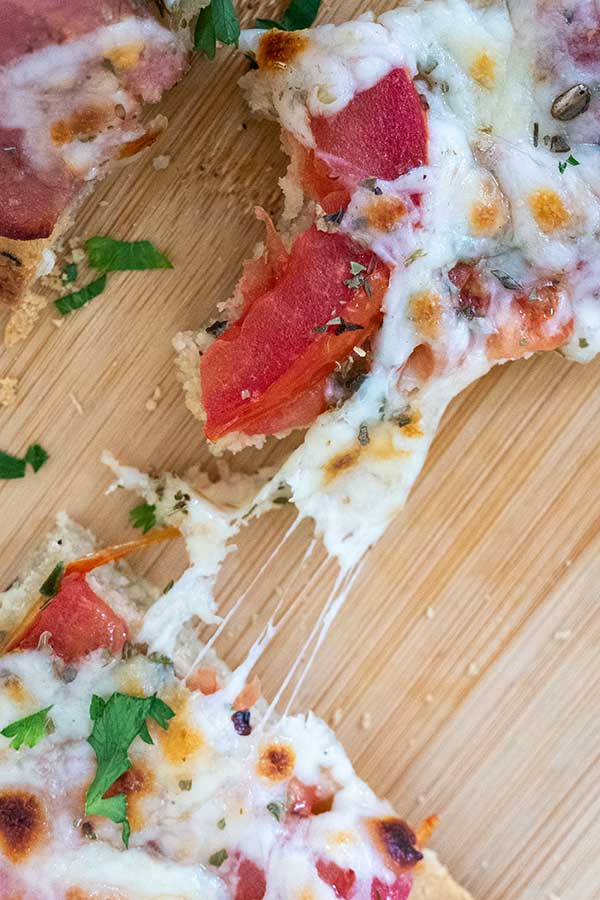 close up of a slice of keto pizza