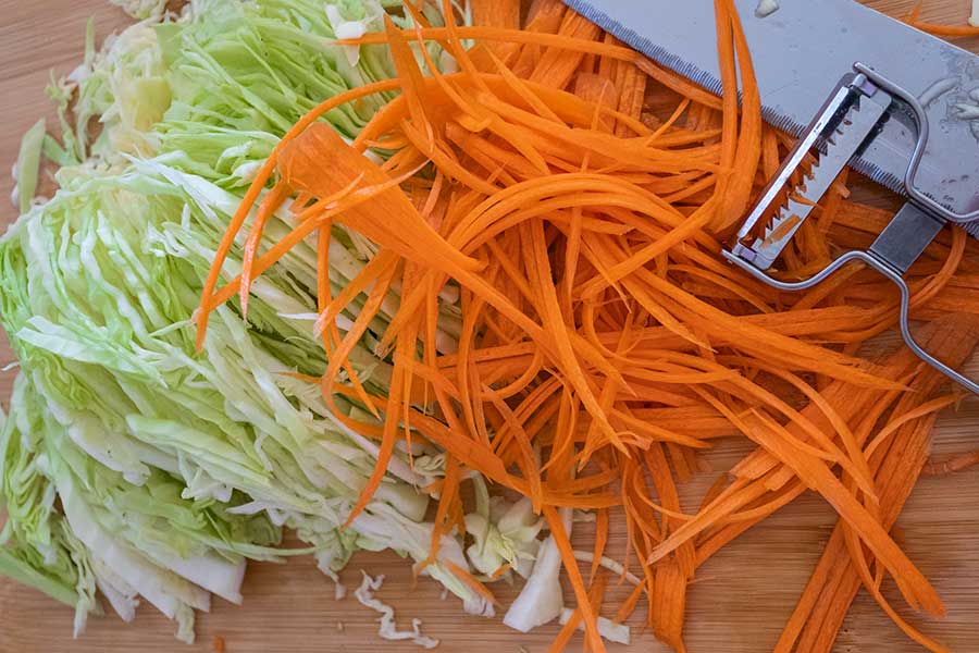 sliced cabbage and carrots