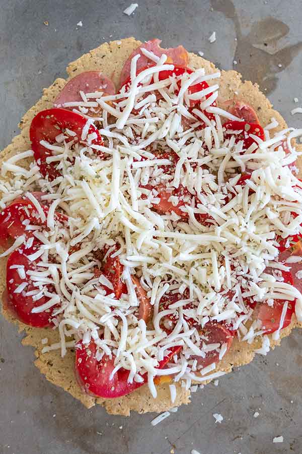 overview of keto pizza with toppings before baking