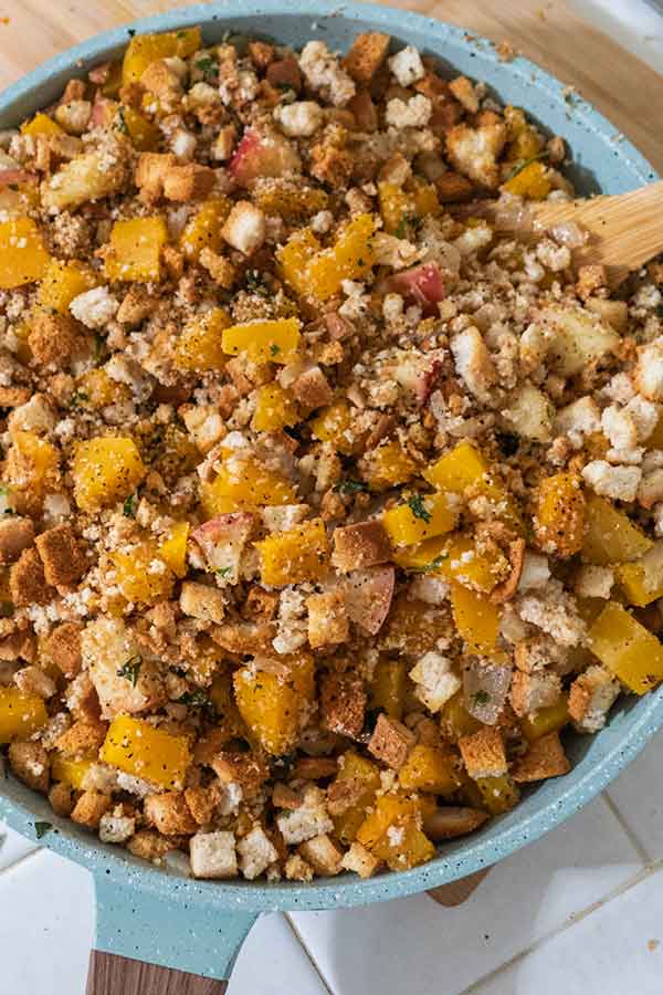 uncooked apple butternut squash stuffing in a skillet