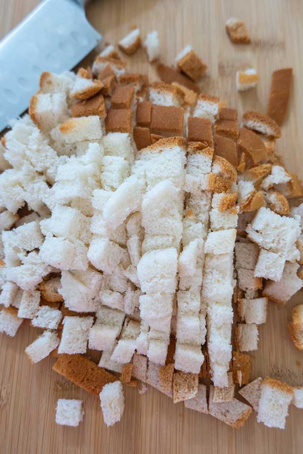 bread cubes on a cutting board