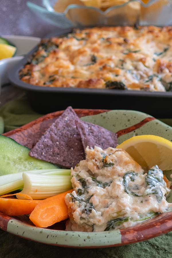 dip in a bowl with chips and veggies