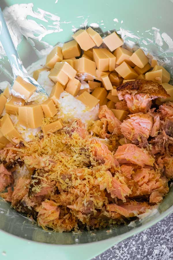 salmon, cubed cheese, lemon zest in a bowl