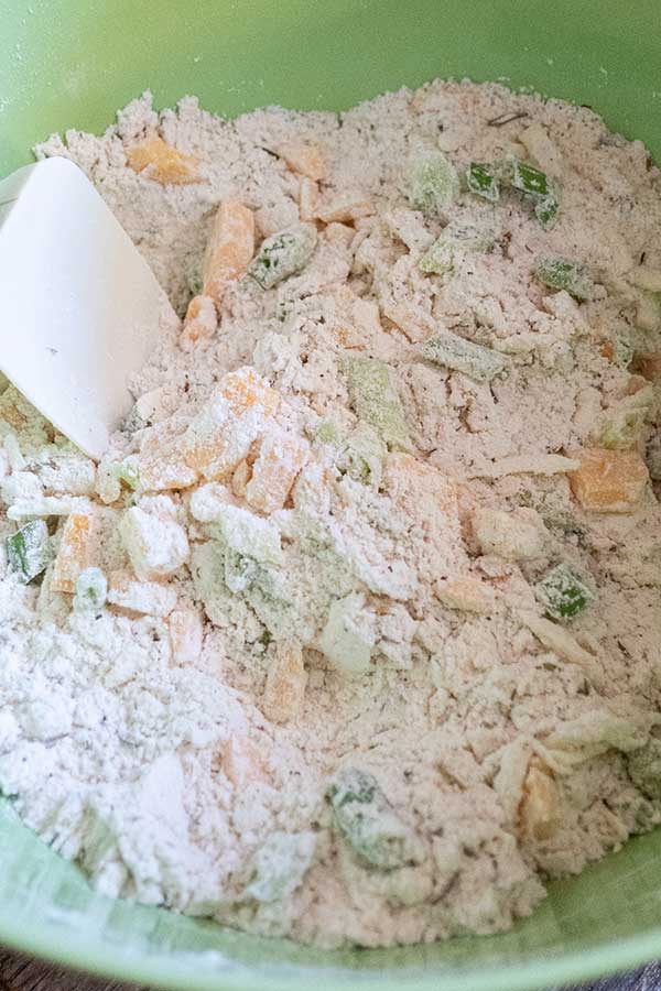 flour, butter, cheese, green onions in a bowl
