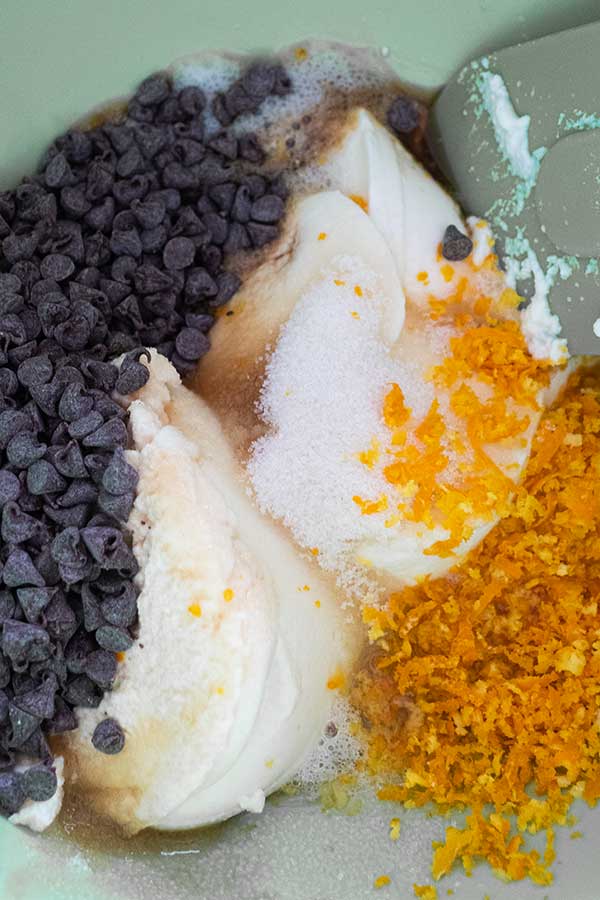 ricotta, chocolate chips, orange zest, sugar and coffee in a bowl