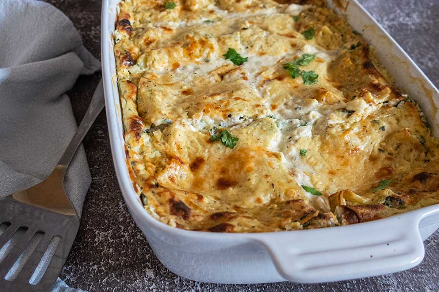 baked white lasagna in a white dish, gluten free