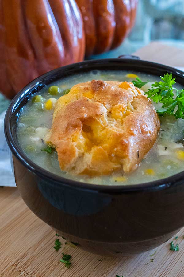 chicken pot pie soup in a cup with gluten-free biscuit