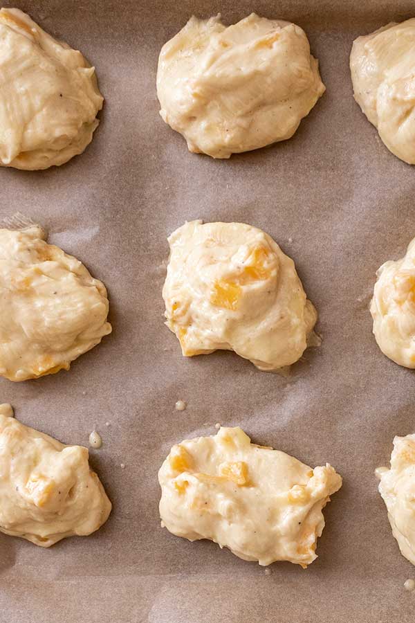 dough mounds on a baking sheet