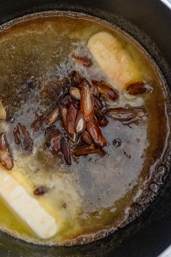 cooking butter, sugar, maple syrup and dates in a pot