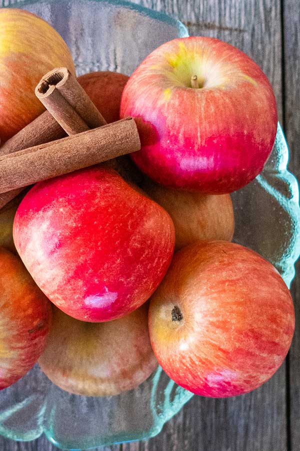 fresh apples and cinnamon sticks