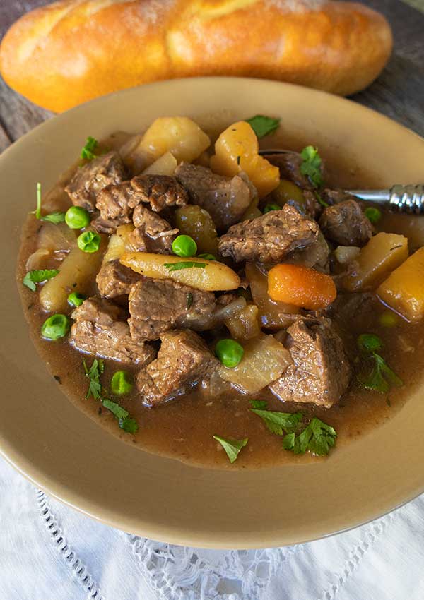 beef stew in a bowl with a spoon