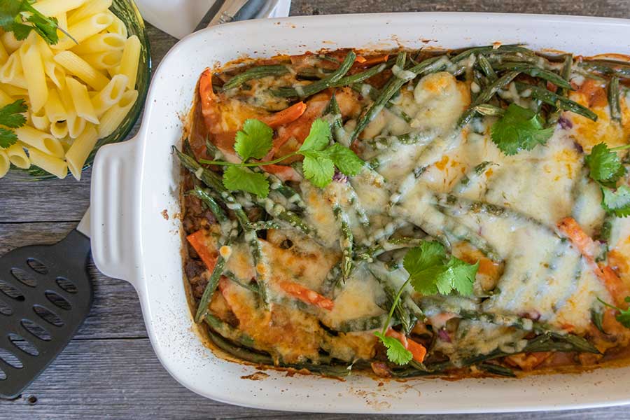 cheesy ground beef and green beans in a casserole dish