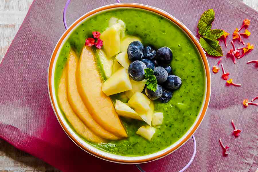 3 June green smoothie bowls topped with fresh fruit