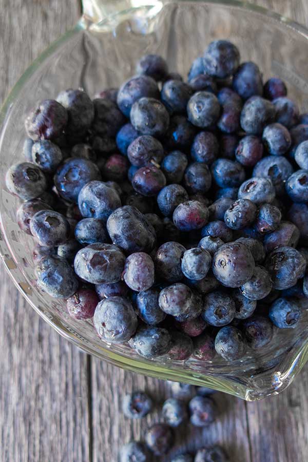 fresh blueberries in a measuring cup