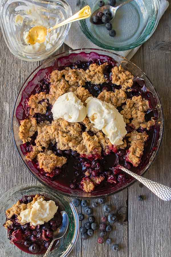 blueberry crumble with toppings in bowls
