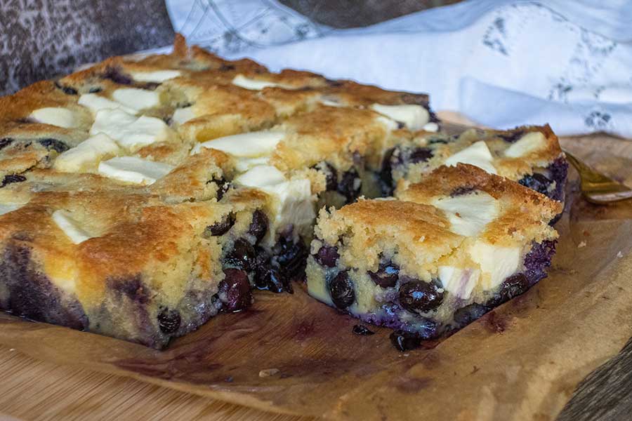 slice of keto and low-carb cream cheese blueberry butter cake