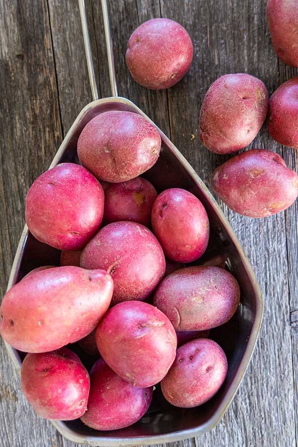 uncooked red potatoes in a colander