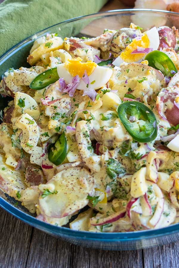 texas potato salad with eggs and jalapenos in a bowl