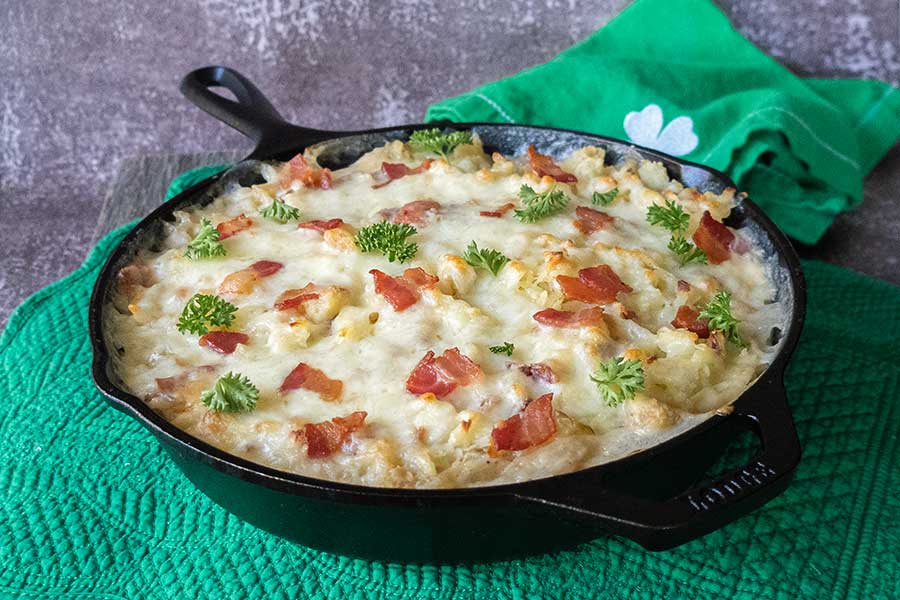 potluck dish of irish skillet potato casserole in a cast iron skillet