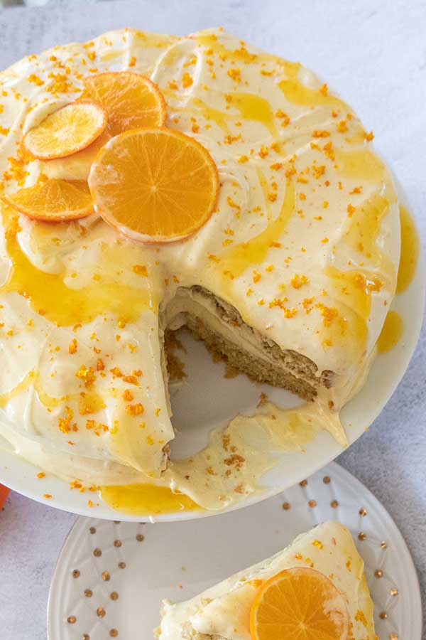 layered orange cake missing a slice