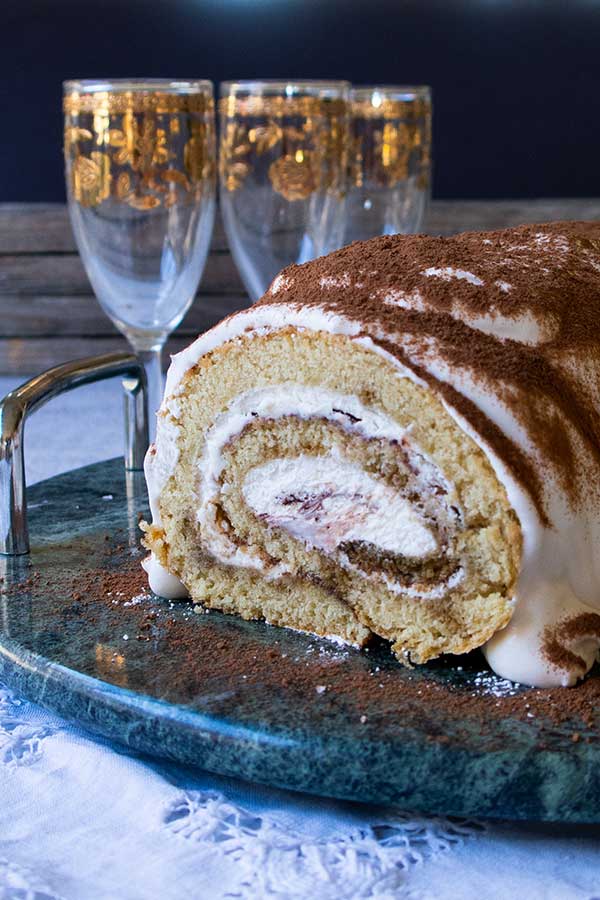 tiramisu Swiss roll on a platter