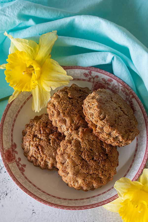 4 jam bellied flax scones on a plate, gluten free