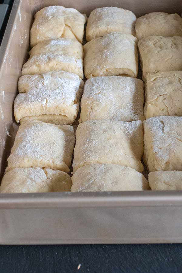 parker house rolls after rising in a pan