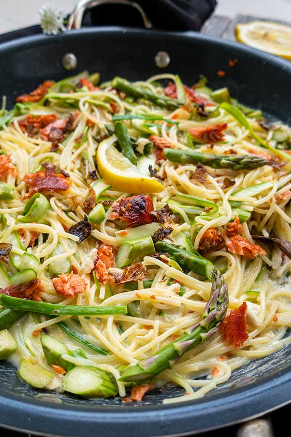 creamy smoked salmon and asparagus pasta in a skillet, gluten free