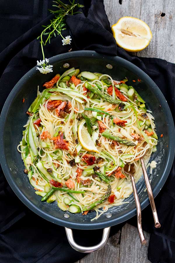 top view of smoked salmon and asparagus pasta in a skillet