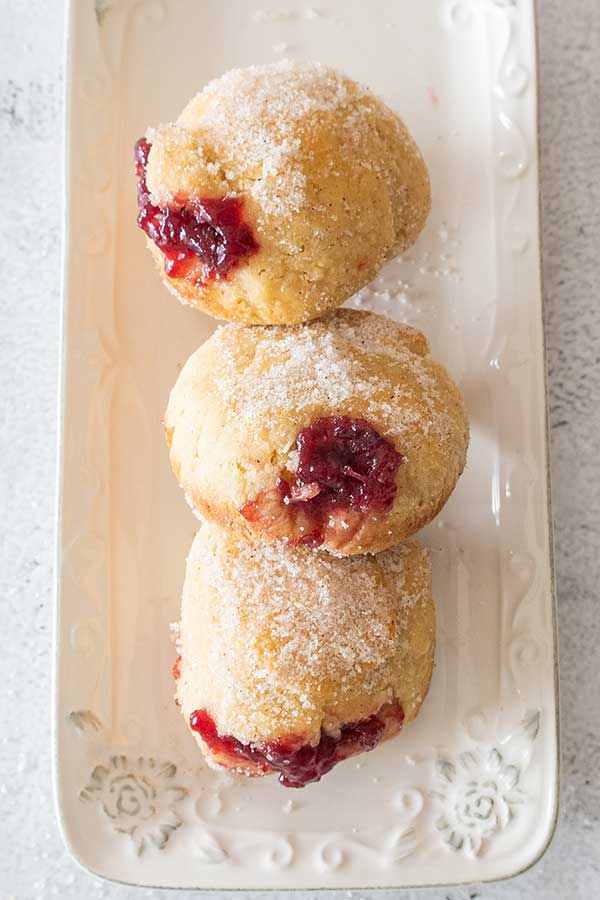 3 baked jelly donuts on a plate