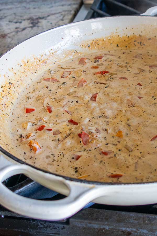 cajun sauce with veggies in a skillet