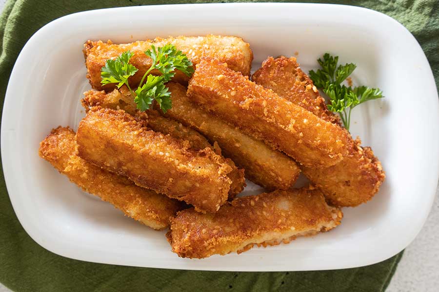 sesame cheese sticks on a plate