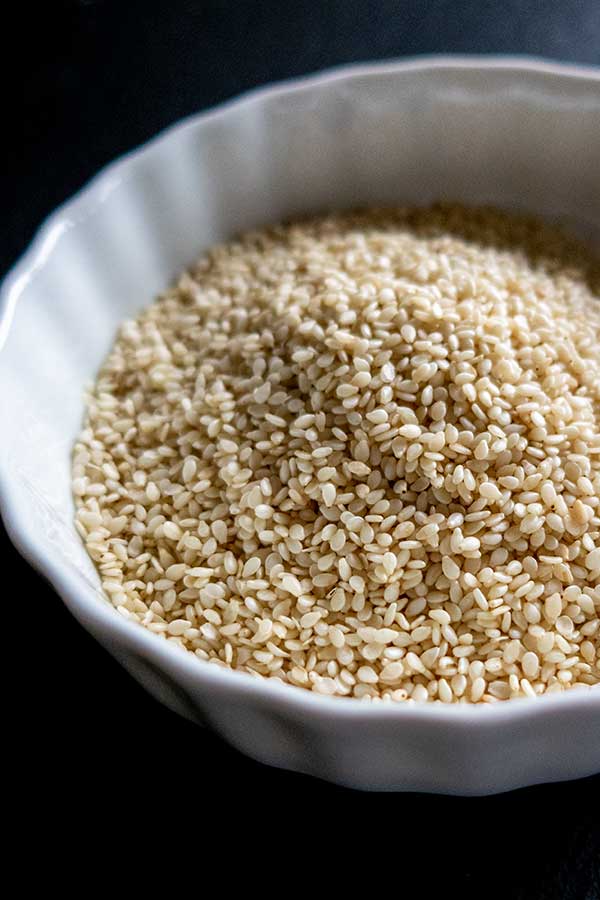 white sesame seeds in a white bowl