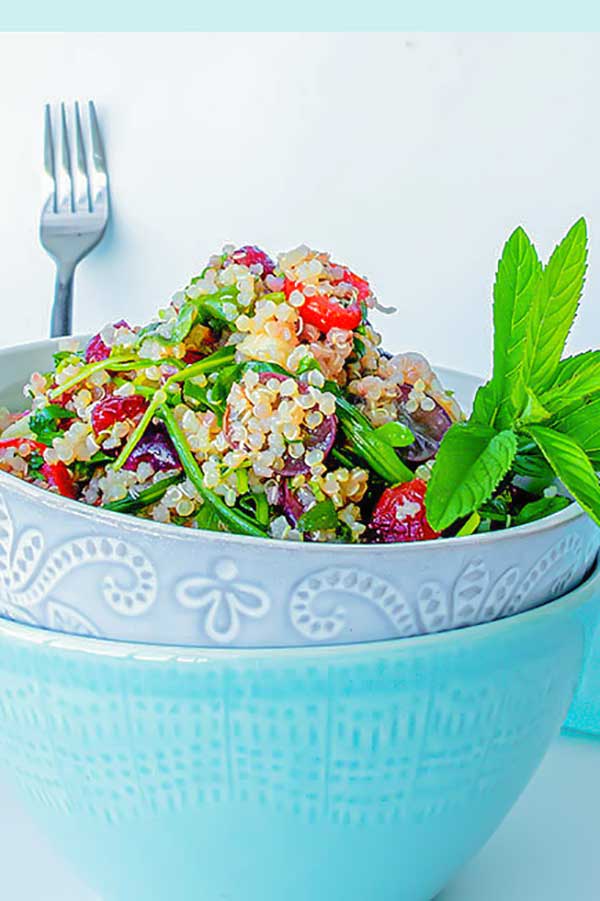 grain salad with quinoa and fruit in a bowl