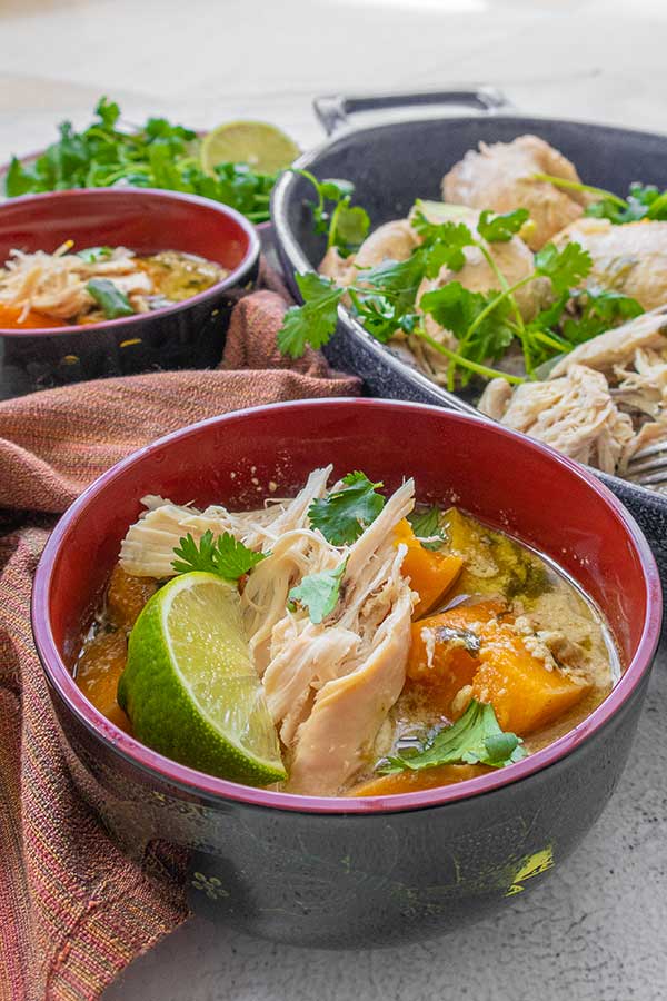 Thai green chicken soup in two bowls for weight loss