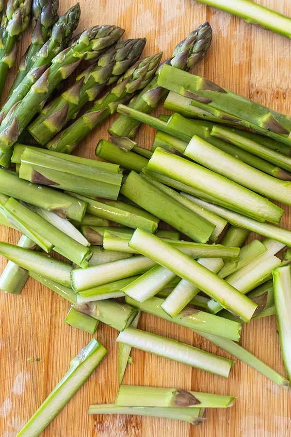 sliced asparagus on a cutting board