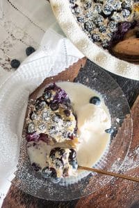 scoop of Blueberry Clafoutis with ice cream on a plate