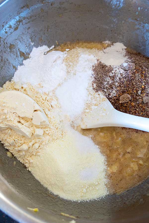 flours mashed banana grated zucchini in a bowl