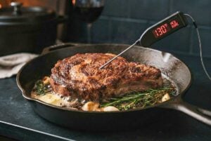 Meat Cooking Temperatures: A Complete Guide to Meat Temps showing a cooked steak in a skillet