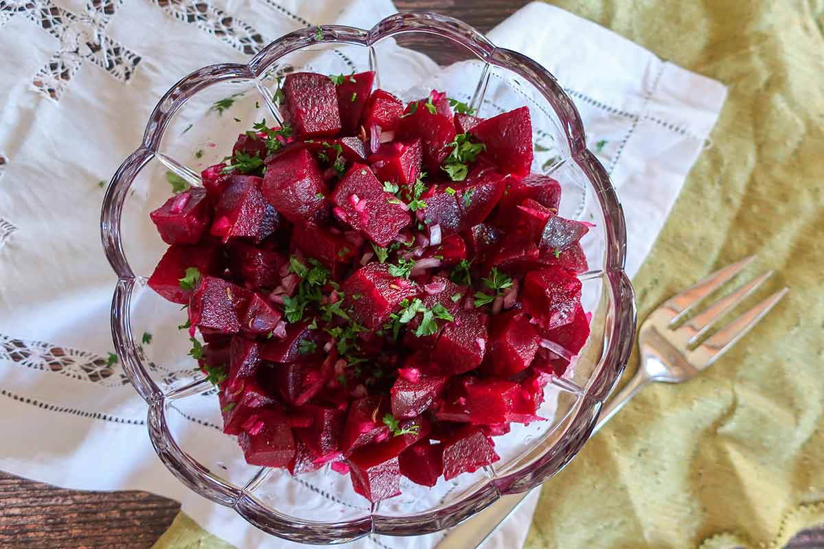 beet salad served in June with herbs in a crystal bowl served as a side dish