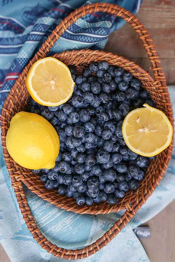 lemons and blueberries in a basket