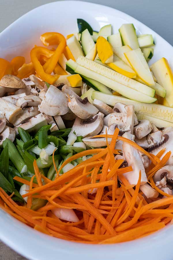 thinly sliced vegetables in a bowl