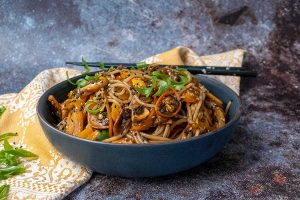 korean noodles in a bowl with chopsticks