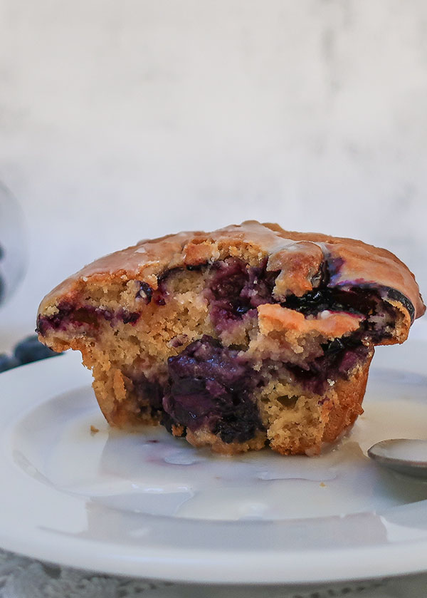 half a gluten free muffin on a plate