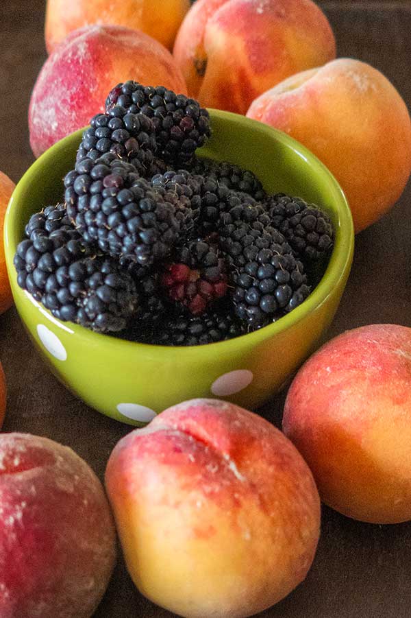 fresh blackberries and peaches