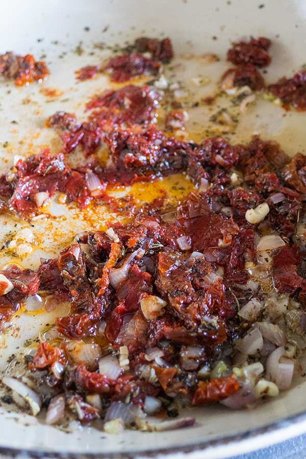 shallots, garlic, sundried tomatoes in a skillet