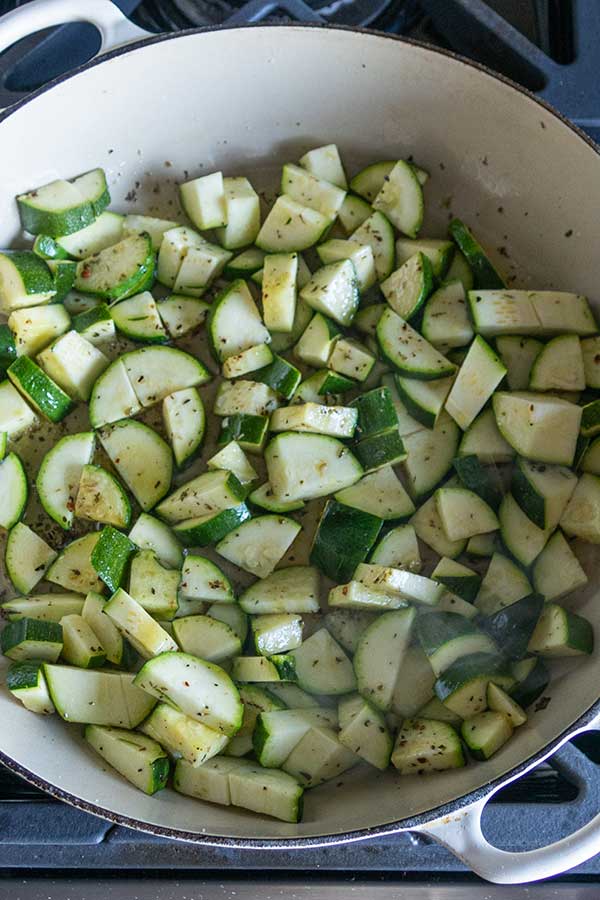 seasoned diced zucchini in a skillet