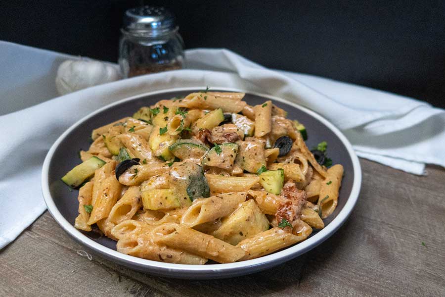 tuscan pasta with zucchini in a bowl